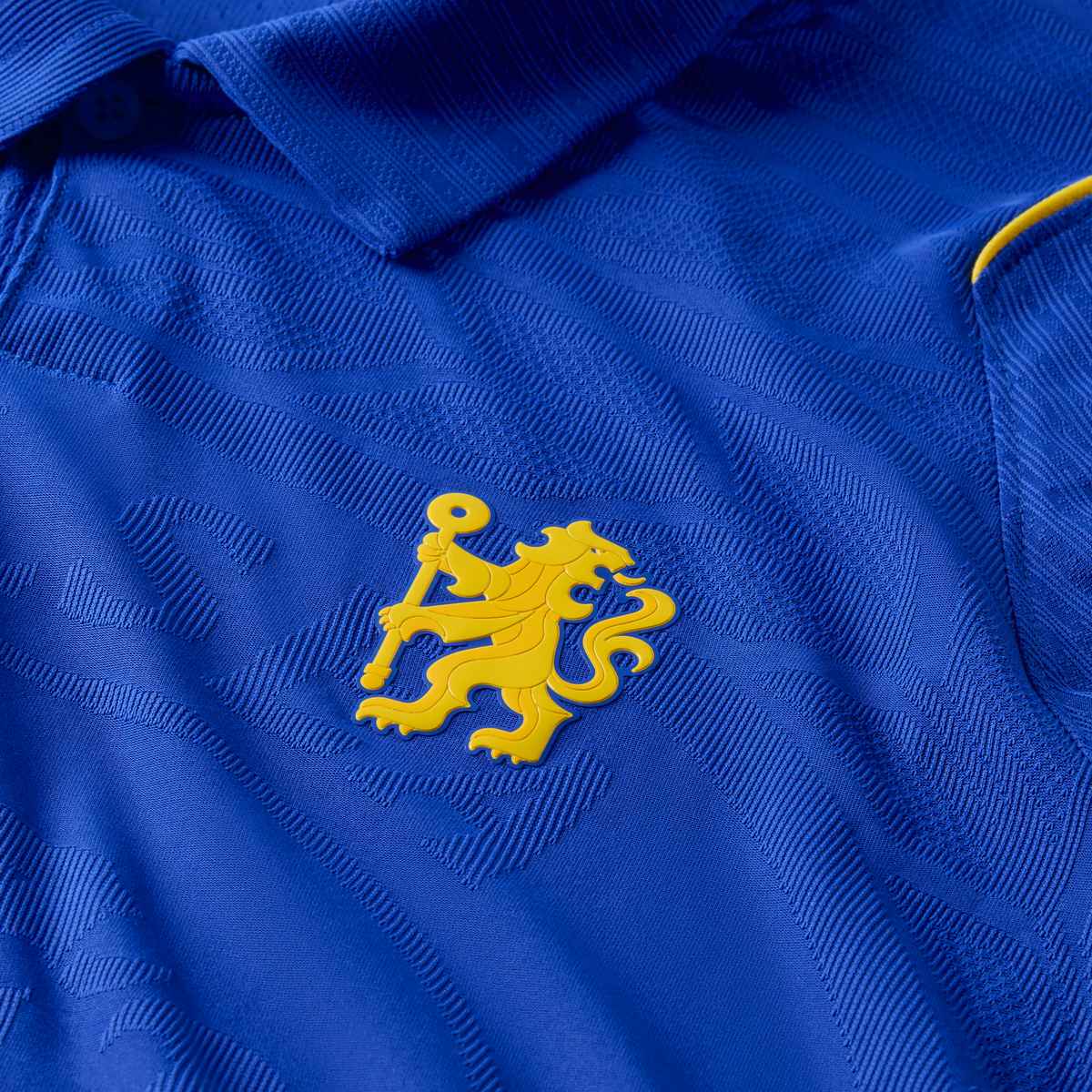 Close-up of a blue sports jersey with a yellow logo