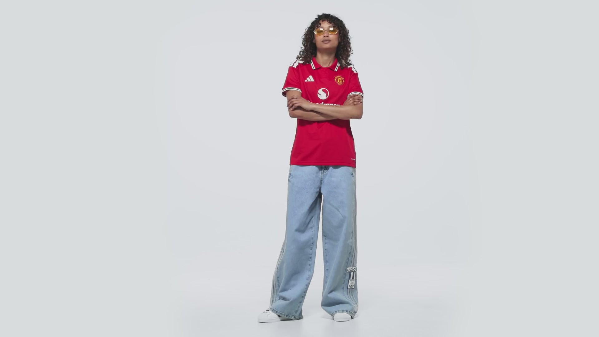 manchester united 2026/27 home shirt, red and white, front view on model
